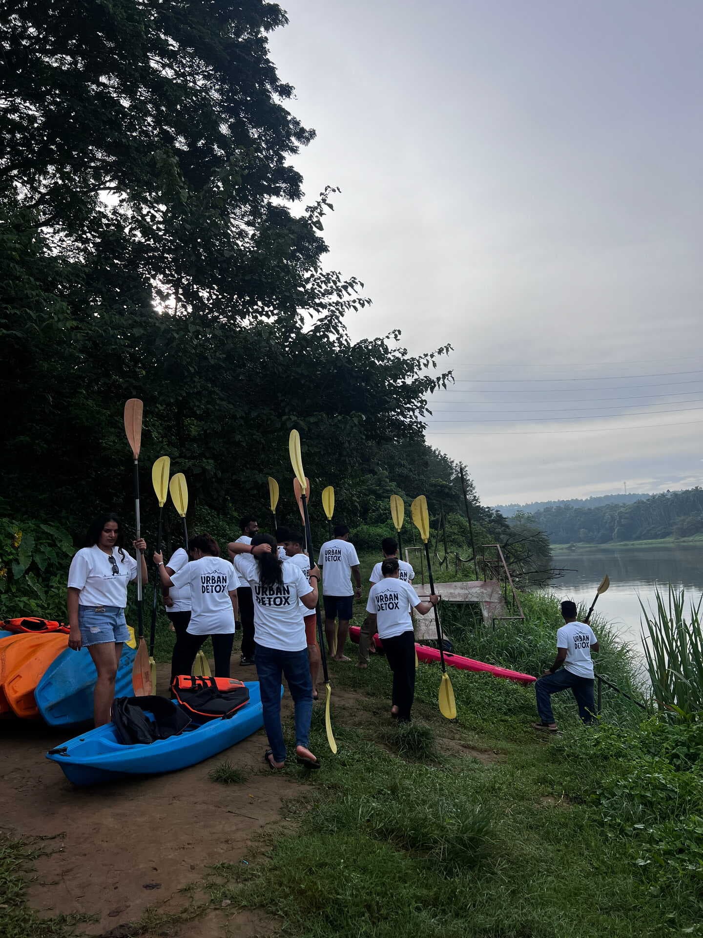 A trip lead walking with travellers in North Kerala
